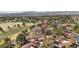 The aerial view shows the golf course and houses with red tile roofs in a mature landscaped setting at 7315 Mission Hills Dr, Las Vegas, NV 89113