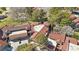 Aerial view of community featuring well-maintained homes with red tile roofs and lush landscaping at 7315 Mission Hills Dr, Las Vegas, NV 89113