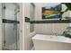 Contemporary bathroom with a modern tub, glass-enclosed shower, and stylish tile accents at 7315 Mission Hills Dr, Las Vegas, NV 89113