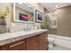 Bathroom with a modern vanity, stylish mirror, and walk-in shower at 7315 Mission Hills Dr, Las Vegas, NV 89113
