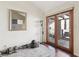 Bright exercise room with sliding glass doors and wood flooring at 7315 Mission Hills Dr, Las Vegas, NV 89113