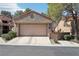 Attractive single-story home with a well-manicured front yard and a two-car garage at 7315 Mission Hills Dr, Las Vegas, NV 89113