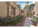 Inviting exterior with brick accents, mature landscaping, and a walkway leading to the entrance at 7315 Mission Hills Dr, Las Vegas, NV 89113