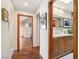 Hallway view showcasing bathroom with modern vanity and ample natural light at 7315 Mission Hills Dr, Las Vegas, NV 89113