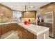 Modern kitchen featuring stainless steel appliances, custom cabinets, and granite countertops at 7315 Mission Hills Dr, Las Vegas, NV 89113