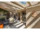 Cozy outdoor patio area, perfect for entertaining, with stylish patio furniture at 7315 Mission Hills Dr, Las Vegas, NV 89113