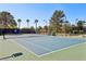 Professionally maintained community tennis court and surrounding park-like atmosphere at 7315 Mission Hills Dr, Las Vegas, NV 89113