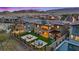 An aerial view showcases a backyard with a fire pit, a hot tub, a pool, and solar panels on the roof at 754 Spirit Lake St, Las Vegas, NV 89138