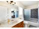 The bathroom features a marble countertop, a sliding glass shower door, and modern fixtures at 7682 Calm Passage Ct, Las Vegas, NV 89139