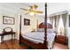 This bedroom features a four-poster bed, and a decorative painting at 7682 Calm Passage Ct, Las Vegas, NV 89139