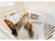 Aerial view of foyer with grand staircase, chandelier, and open layout at 7682 Calm Passage Ct, Las Vegas, NV 89139