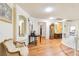 Upstairs living room with hardwood floors, decorative molding, and an elegant chair at 7682 Calm Passage Ct, Las Vegas, NV 89139