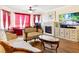 Cozy living room featuring a fireplace, comfortable seating, and a large TV at 7682 Calm Passage Ct, Las Vegas, NV 89139