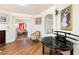 Upstairs living room with hardwood floors, decorative molding, and a katana display at 7682 Calm Passage Ct, Las Vegas, NV 89139