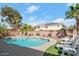 Backyard with a pool, spa, and lounge chairs, perfect for outdoor relaxation at 7682 Calm Passage Ct, Las Vegas, NV 89139