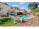 A large backyard pool and patio area, with a view of the home's exterior at 7682 Calm Passage Ct, Las Vegas, NV 89139