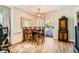 Charming dining area featuring a modern chandelier, table with seating for four, and sliding glass doors at 7950 W Flamingo Rd # 1081, Las Vegas, NV 89147