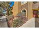 Charming condo featuring an stucco exterior, a walkway entrance, and mature shade trees creating a welcoming curb appeal at 7950 W Flamingo Rd # 1081, Las Vegas, NV 89147