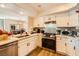 Well-equipped kitchen with stainless steel appliances, white cabinets, and open to the dining area at 7950 W Flamingo Rd # 1081, Las Vegas, NV 89147