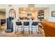 Stylish kitchen bar featuring a waterfall fountain, seating for three, and stainless steel appliances at 7950 W Flamingo Rd # 1081, Las Vegas, NV 89147