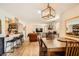 Open-concept living space with dining table, kitchen bar, and living room with a fireplace at 7950 W Flamingo Rd # 1081, Las Vegas, NV 89147
