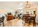 Open-concept living space with dining table, fireplace, and modern furniture at 7950 W Flamingo Rd # 1081, Las Vegas, NV 89147