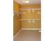 Spacious walk in closet with tile flooring, white shelving, and neutral paint at 8003 Retriever Ave, Las Vegas, NV 89147