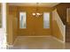 Open dining area with tile flooring, staircase, and natural lighting at 8003 Retriever Ave, Las Vegas, NV 89147