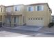Two story home with a front yard, two car garage and neutral paint at 8003 Retriever Ave, Las Vegas, NV 89147