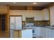 Bright kitchen has white cabinets, granite countertops, and stainless appliances at 8003 Retriever Ave, Las Vegas, NV 89147