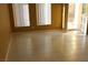 Bright living room featuring tile floors, two windows and a glass door for lots of natural light at 8003 Retriever Ave, Las Vegas, NV 89147