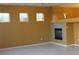 Spacious living room with a fireplace, tile flooring, and natural lighting at 8003 Retriever Ave, Las Vegas, NV 89147
