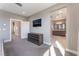 Spacious main bedroom with TV and dresser, leading into a luxurious ensuite bathroom at 8042 Skye Bridge St, Las Vegas, NV 89166