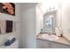 Well-lit half bathroom with granite countertop and neutral decor at 8440 Wandering Sun Ave, Las Vegas, NV 89129