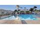 Sparkling community pool with lounge chairs and a fenced-in area, perfect for relaxation and recreation at 8440 Wandering Sun Ave, Las Vegas, NV 89129