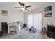 Bright dining area with a ceiling fan, a glass top table and tiled floors at 8440 Wandering Sun Ave, Las Vegas, NV 89129
