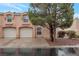 Charming townhome featuring an attached garage and well-maintained landscaping at 8440 Wandering Sun Ave, Las Vegas, NV 89129