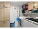 Convenient laundry room with washer, dryer, and plenty of storage space at 8440 Wandering Sun Ave, Las Vegas, NV 89129