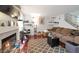 Another angle showing a cozy living room featuring a fireplace and hardwood floors at 8440 Wandering Sun Ave, Las Vegas, NV 89129