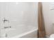 Clean bathroom with white tiled shower and soaking tub at 9099 Nostrand Ave, Las Vegas, NV 89148