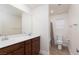 Bright bathroom features double vanity and shower-tub combo at 9099 Nostrand Ave, Las Vegas, NV 89148