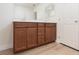 Bathroom featuring a double sink vanity with wood cabinets and a white countertop at 9099 Nostrand Ave, Las Vegas, NV 89148