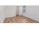 Bedroom with light wood-look floors, natural light from the window, and a closet for storage at 9099 Nostrand Ave, Las Vegas, NV 89148