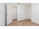 Bright bedroom features wood-look flooring, closet, and neutral paint at 9099 Nostrand Ave, Las Vegas, NV 89148