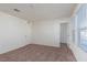 Bright bedroom with neutral walls, plush carpeting, and natural light from the large window at 9099 Nostrand Ave, Las Vegas, NV 89148