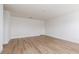 Bonus room highlighting wood-look floors, fresh paint, and ample space for activities at 9099 Nostrand Ave, Las Vegas, NV 89148