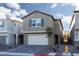 Beautiful home featuring a well-kept lawn, paved driveway and covered entryway at 9099 Nostrand Ave, Las Vegas, NV 89148