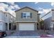 Charming home with brick driveway, two-car garage, and neutral color scheme at 9099 Nostrand Ave, Las Vegas, NV 89148