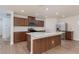 Stylish kitchen with an island, modern appliances, and white countertops at 9099 Nostrand Ave, Las Vegas, NV 89148