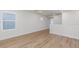 Bright living room with wood-look flooring and natural light from window at 9099 Nostrand Ave, Las Vegas, NV 89148